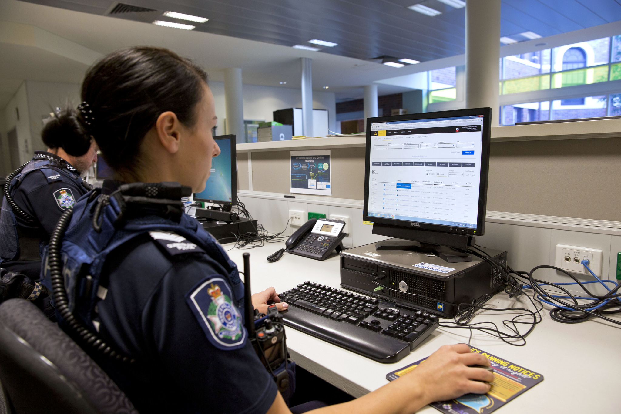 officer typing at a computer