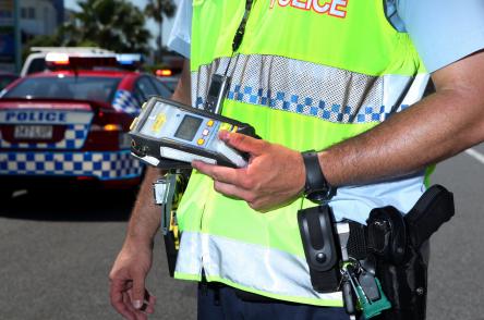 breath analyser held by an officer