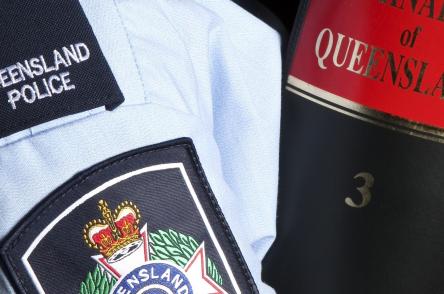 Officer holding a law book