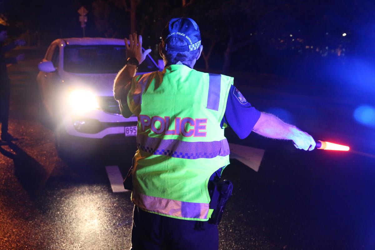 Officer flagging down a vehicle