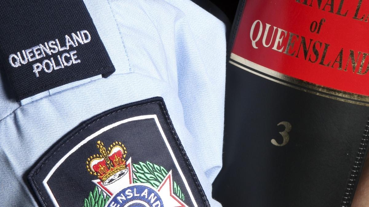 Officer holding a law book