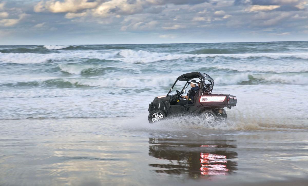 police vehicle on beach